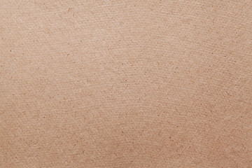 Brown cardboard sheet abstract texture or background.