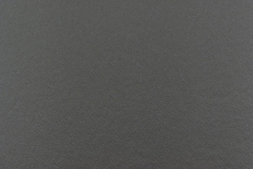 Gray cardboard sheet abstract texture or background.