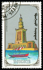 Ukraine - circa 2018: A postage stamp printed in Mongolia show Lighthouse of Alexandria. Series: 7 Wonders of the Ancient World. Circa 1990.