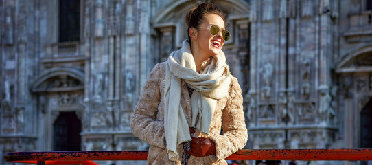 Fototapeta na wymiar happy traveller woman in Milan, Italy looking into distance