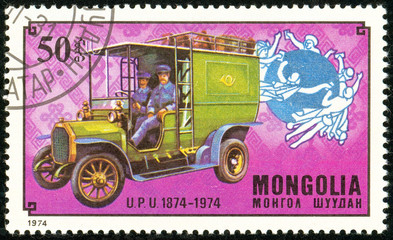Ukraine - circa 2018: A postage stamp printed in Mongolia show German post car. Series: U.P.U....