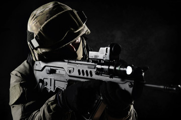 The man in the image of a member of the SWAT police with weapons