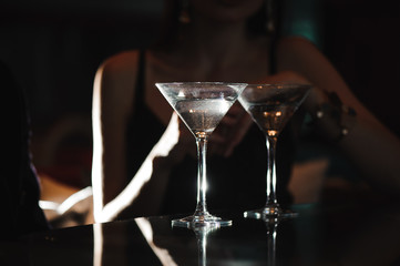 Two glasses of martini coctail in a bar