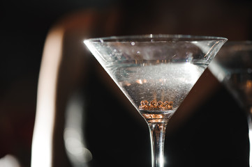 A martini glass with a ring