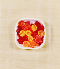 Gummy Bear Candy Colorful Background on wood