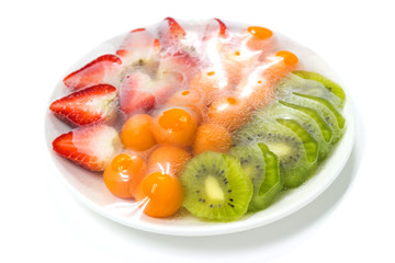 fruits which are wrapped with plastic film preservation on a table on white background.