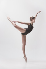 Young classical dancer isolated on white background.