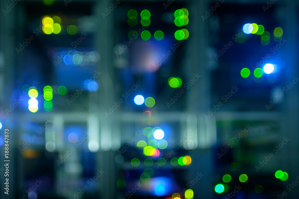 Poster blurred image of network server room with computers.