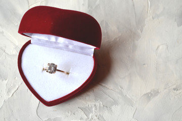 Engagement ring in the box. The ring as a symbol of love.