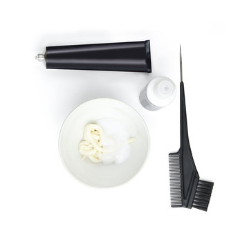 Hair coloring set with hair dye, paintbrush, hairbrush, paint containers on white background, for home hair coloring