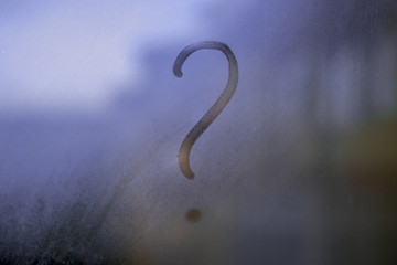 Fototapeta premium Question mark on misted glass