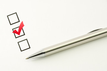 survey template, questionnaire choice, marked check box with a pen on paper background