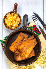 Pieces of cod in breadcrumbs.