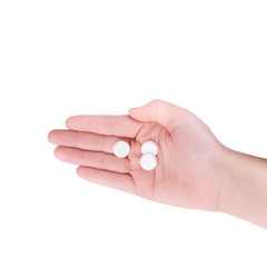 Pills in the palm of your hand on a white background