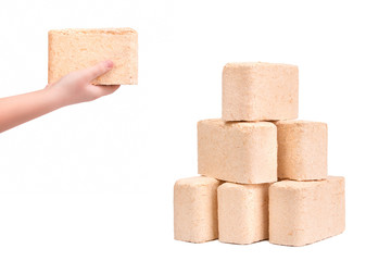 Eco firewood on white background. Briquette firewood from pressed sawdust