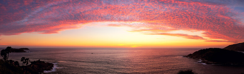 Panorama view point - Phromthep cape with cirrostratus cloud and dramatic sunset sky, Phuket Island, Thailand.
