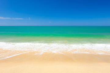 Fototapeta na wymiar Wave on the beach in sunshine day.