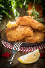 Fried cod slices in breadcrumbs.