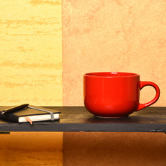 Hot coffee on black table in modern interior.
