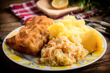 Fried cod fillet served.