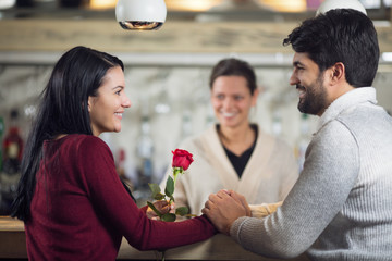 Young couple dating in cafe
