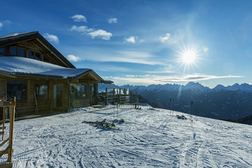 Dolomites, ski area with beautiful slopes. Empty ski slope in winter on a sunny day. Prepared piste and sunny day