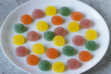 Marmalade sweets on a white table.