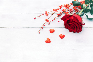 Red rose on wooden background, for valentine's day