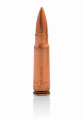 Bullet of 7.62 mm caliber isolated on white background with shadow reflection. Unfired ammunition for assault rifles like the AK-47 Kalashnikov, Czechoslovakian VZ. 58.