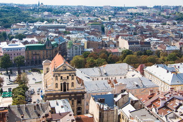 Fototapeta na wymiar View to the city of Lviv from Town Hall. Aerial view on the old centre of Lviv in Ukraine. Europe.