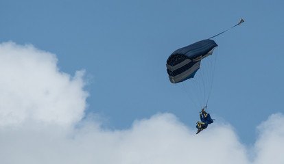 Naklejka na ściany i meble paraglider is landing