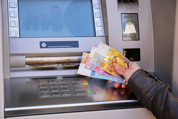 woman hand hold swiss franc banknotes