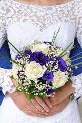 Wedding bouquet of flowers and wedding rings.
Wedding day.