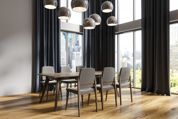 White dining room corner, black curtains