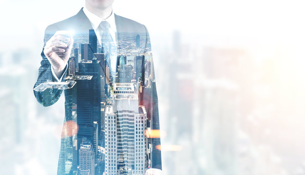 Glowing marker businessman, foggy city - Powered by Adobe