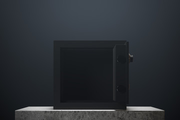 Open safe box, black wall