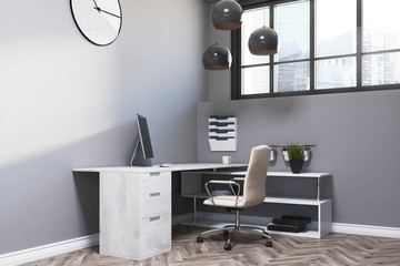 Gray office workplace, clock