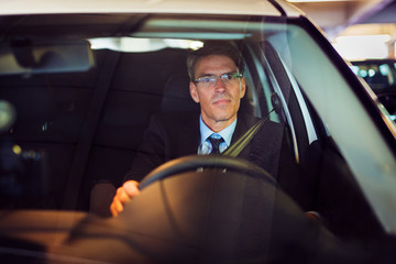 Businessman Starting His Car