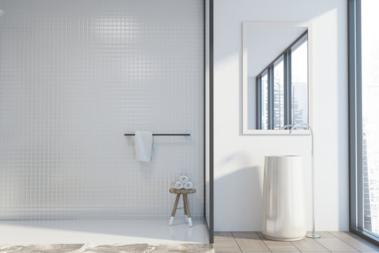 White and tiled bathroom, round sink