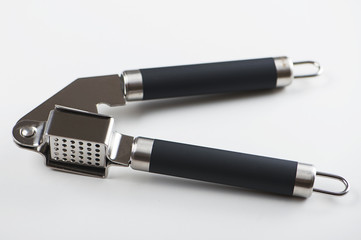 Garlic squeezer on white background. Isolated. Food