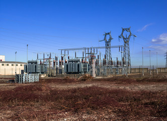 power plant in a peripheral industrial area surrounded by uncultivated fields