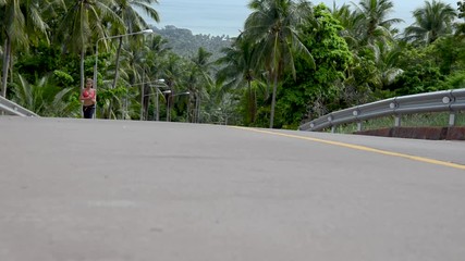 fitness woman running at tropical forest trail