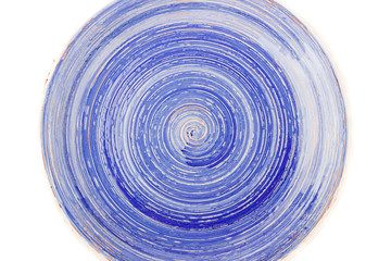 Blue round ceramic plate with spiral pattern, isolated on white