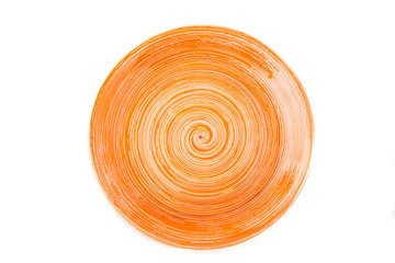 Orange round ceramic plate with spiral pattern, isolated on white