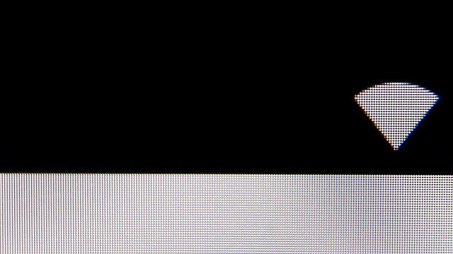 Lonely WIFI icon on the Screen of phone. MACRO VIDEO where the pixels of the screen are visible.