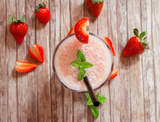 strawberry smoothie on wood table