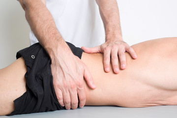 Massage therapist giving a back massage