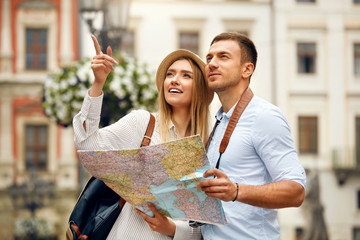 Couple With Map On Travel Vacations, Sightseeing - obrazy, fototapety, plakaty