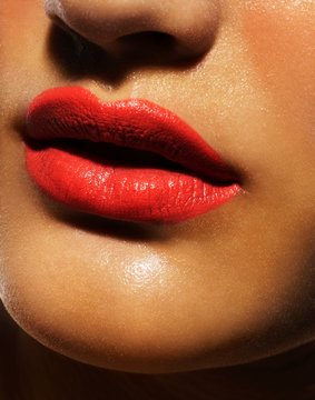 Close up of woman's lips with red lipstick