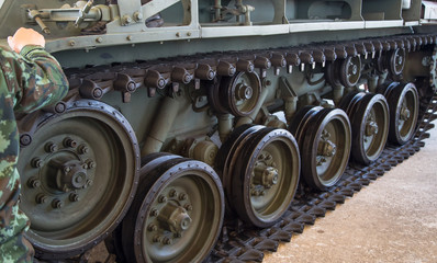 Fototapeta na wymiar Close-up of drive sprocket of tank